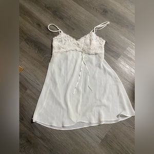 Vintage white slip with rosettes